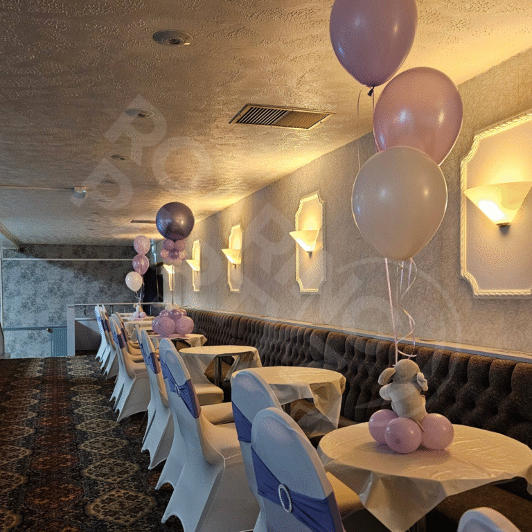 Venue Dressing including chair covers with bands, table covers and elephant themed centrepieces