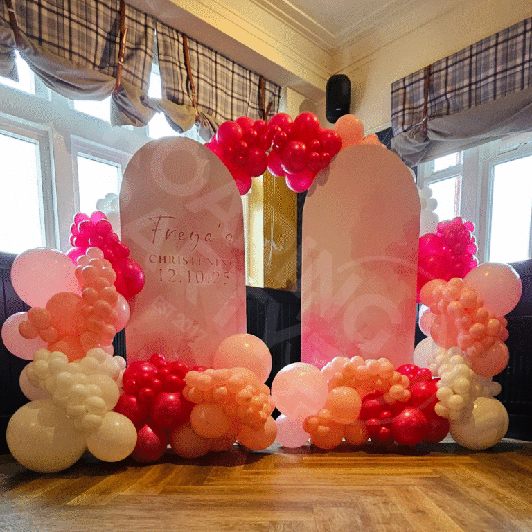 Double Personalised Arch Backdrop and deluxe garlands at a venue in Melling