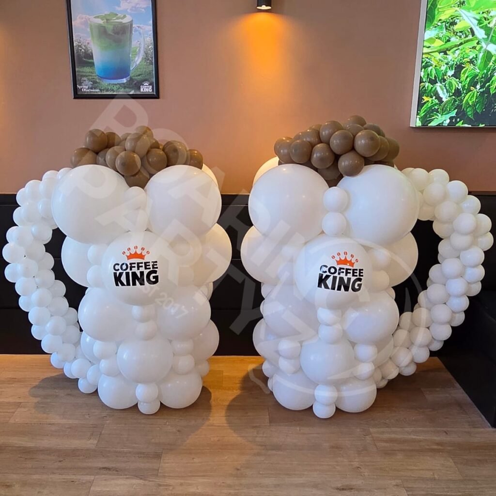 Two custom branded balloon Coffee Mugs for Coffee King's grand opening in Southport.