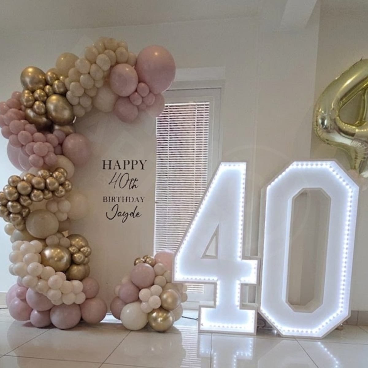 Personalised Arch Backdrop with Deluxe Balloon Garland and Light Up 40 at a house in Liverpool