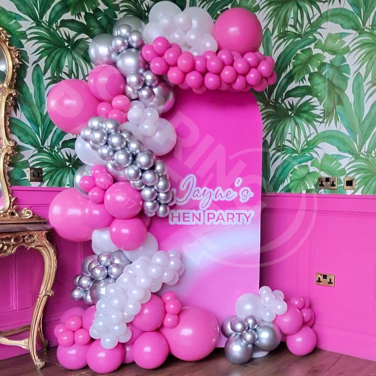 A Personalised arch backdrop with deluxe balloon garland in the Creation Suite at the Shankly Hotel in Liverpool for a hen party
