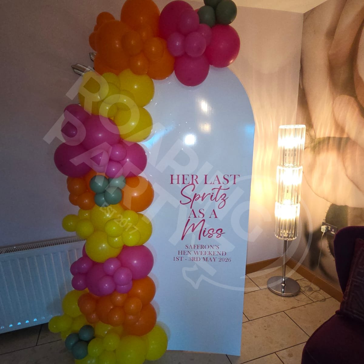 Personalised backdrop with standard balloon arch in the Posh Pads Apartments in Liverpool for a hen party