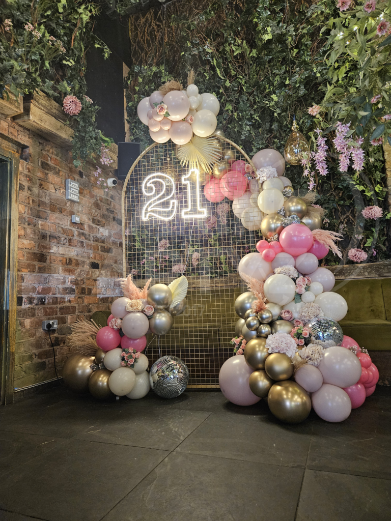 Golden Arch Frame with Neons, Deluxe Garland, Disco Balls and Florals in a Liverpool City Centre Venue