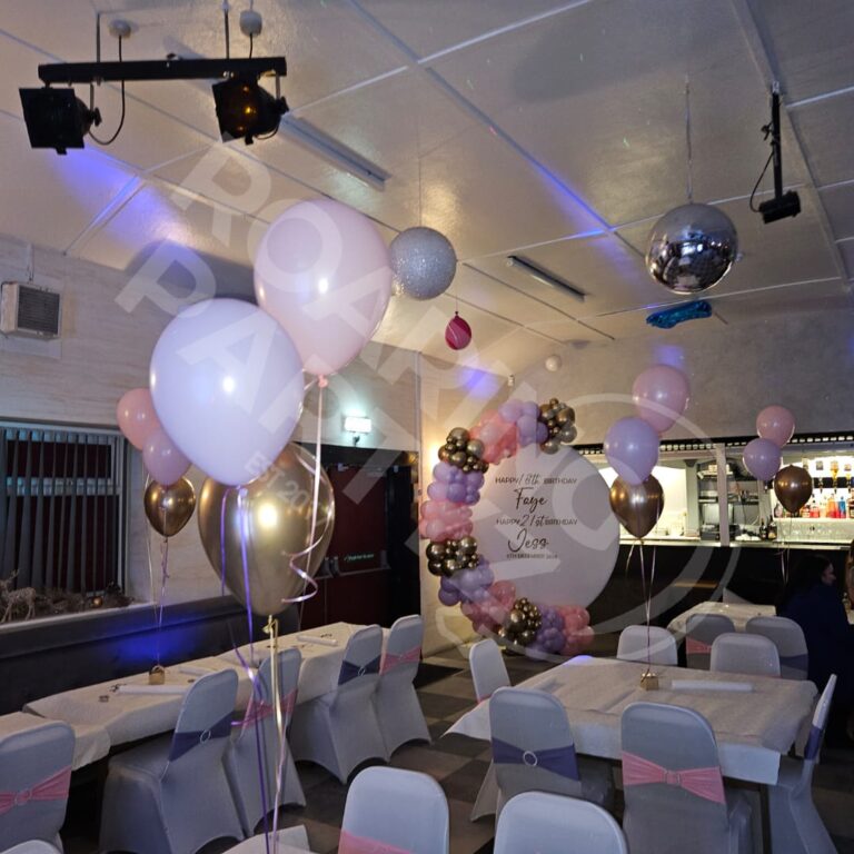 Venue Dressing at the Mell Inn for a joint 18th & 21st birthday featuring personalised balloon hoop, table clusters, chair dressing and table covers.
